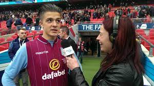Jack Grealish being interviewed by Juliette while he was at Aston Villa.
